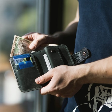 Person looking through wallet